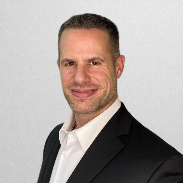 Head shot of Phil Alampi, Chief Revenue Officer at Aclaimant